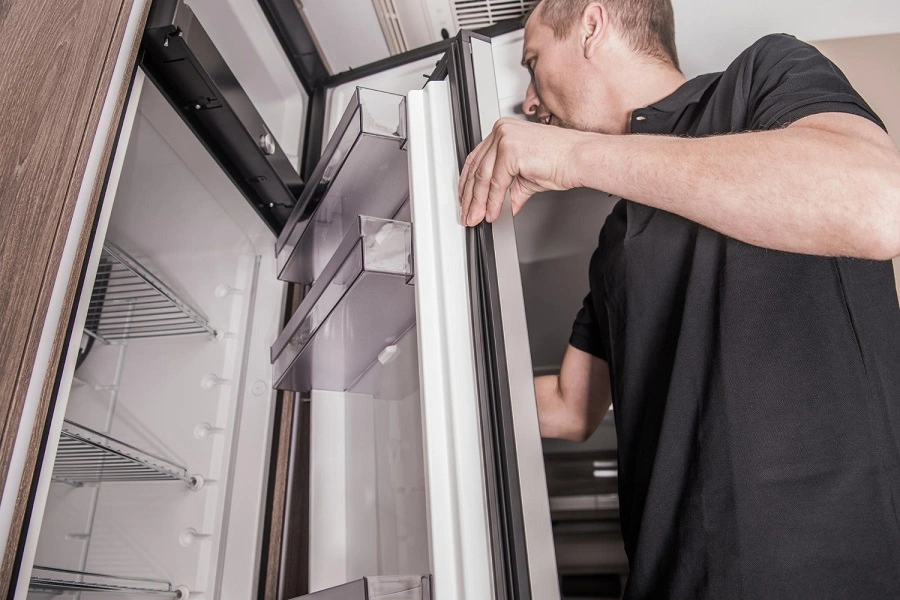 Technician repairing Refrigerator Repair in la